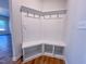 Inviting mudroom features white cabinets, coat hooks and bench seating for convenience and organization at 394 Duncan Creek Rd # 158, Lillington, NC 27546