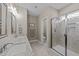 Bathroom featuring double vanity, tile floors, and walk in shower at 405 Joseph Alexander Dr, Fuquay Varina, NC 27526