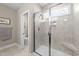 Bathroom with a glass-enclosed shower and tiled walls at 405 Joseph Alexander Dr, Fuquay Varina, NC 27526