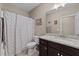 Bathroom features a shower-tub combo, tile flooring and granite countertops at 405 Joseph Alexander Dr, Fuquay Varina, NC 27526