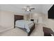 Bedroom with neutral walls, carpeted floor, ceiling fan and dark wood furniture at 405 Joseph Alexander Dr, Fuquay Varina, NC 27526
