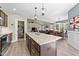 Bright kitchen with granite countertops, stainless steel appliances, and an open floor plan at 405 Joseph Alexander Dr, Fuquay Varina, NC 27526