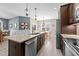 Modern kitchen with granite countertops, stainless steel appliances, and an island with a sink at 405 Joseph Alexander Dr, Fuquay Varina, NC 27526