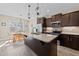 Modern kitchen with granite countertops, stainless steel appliances, and an island with seating at 405 Joseph Alexander Dr, Fuquay Varina, NC 27526