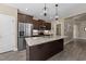Spacious kitchen with a granite island and stainless steel appliances at 405 Joseph Alexander Dr, Fuquay Varina, NC 27526