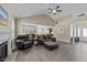 Open-concept living room with a fireplace, seamlessly connected to the dining area and kitchen at 405 Joseph Alexander Dr, Fuquay Varina, NC 27526