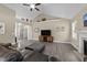 Spacious living room with high vaulted ceilings, a fireplace, and lots of natural light at 405 Joseph Alexander Dr, Fuquay Varina, NC 27526