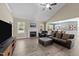 Cozy living room with a fireplace, vaulted ceilings, and plenty of natural light at 405 Joseph Alexander Dr, Fuquay Varina, NC 27526