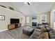 Comfortable living room featuring a fireplace, vaulted ceiling, and stylish furnishings at 405 Joseph Alexander Dr, Fuquay Varina, NC 27526