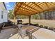 Relax on the charming patio with a pergola, grill, and outdoor seating perfect for entertaining guests at 405 Joseph Alexander Dr, Fuquay Varina, NC 27526
