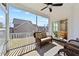 Screened-in patio with wicker furniture and view of the landscaped backyard at 405 Joseph Alexander Dr, Fuquay Varina, NC 27526