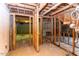 Unfinished basement featuring open framework, concrete floors, and exposed fixtures, ready for customization and finishing at 407 Granville Rd, Chapel Hill, NC 27514