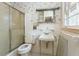 Cozy bathroom with classic fixtures, including a vintage sink and a shower-tub combination at 407 Granville Rd, Chapel Hill, NC 27514