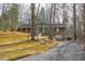 Lovely brick home with a long driveway surrounded by mature trees at 407 Granville Rd, Chapel Hill, NC 27514