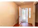 A bright foyer features a glass-paneled front door and hardwood floors, welcoming guests into the home at 407 Granville Rd, Chapel Hill, NC 27514
