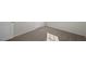 Carpeted bedroom featuring a double door and a window at 413 Citron St, Sanford, NC 27332