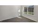 Light-filled bedroom with large window overlooking the yard and modern vinyl flooring at 413 Citron St, Sanford, NC 27332