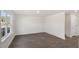 A sun-lit living room with luxury vinyl plank flooring and large windows at 413 Citron St, Sanford, NC 27332