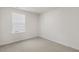 Bedroom with neutral walls and carpet features a window providing natural light at 417 Citron St, Sanford, NC 27332
