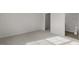 Bedroom with neutral carpet leading to a walk-in closet and a view into the attached bathroom at 417 Citron St, Sanford, NC 27332