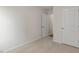 Bedroom with neutral carpet and white walls, with doors to closet and hall at 417 Citron St, Sanford, NC 27332