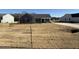 Charming one-story home featuring gray siding, black shutters, covered entry, and a well-manicured lawn at 44 Harvest Hills Ln, Dunn, NC 28334