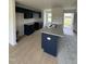 Modern kitchen with granite countertops, stainless appliances, and convenient access to the front entrance at 44 Harvest Hills Ln, Dunn, NC 28334
