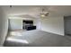 Open-concept living space with plush carpeting flowing into the kitchen area at 44 Harvest Hills Ln, Dunn, NC 28334