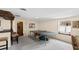 Carpeted basement with a ping pong table, window, and view to another room at 5008 Hermitage Dr, Raleigh, NC 27612