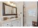 Bathroom featuring a granite countertop, modern vanity, and glass-enclosed shower at 5008 Hermitage Dr, Raleigh, NC 27612