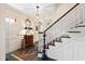 Traditional foyer with a staircase, slate floors, and decorative accents at 5008 Hermitage Dr, Raleigh, NC 27612