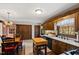 Traditional eat-in kitchen with wood cabinets, butcher block island, and lots of natural light at 5008 Hermitage Dr, Raleigh, NC 27612