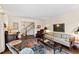 Inviting living room featuring a decorative rug, plush seating, and elegant decor at 5008 Hermitage Dr, Raleigh, NC 27612
