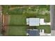 Aerial view of a home with a large backyard, showcasing the patio and driveway at 505 Colleton Rd, Raleigh, NC 27610