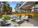 Spacious backyard with patio furniture, covered patio, and a fenced-in yard at 505 Colleton Rd, Raleigh, NC 27610