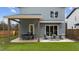 Covered patio with outdoor dining and seating offering a view of the expansive backyard at 505 Colleton Rd, Raleigh, NC 27610