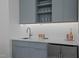 Stylish bar area with modern cabinets, a sink, and beverage cooler at 505 Colleton Rd, Raleigh, NC 27610