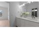 Bathroom featuring a double sink vanity, ample lighting, and modern fixtures at 505 Colleton Rd, Raleigh, NC 27610