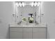 Modern bathroom with double sinks, a large mirror, and white cabinetry at 505 Colleton Rd, Raleigh, NC 27610