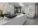 A luxury bathroom with a double vanity, stand alone tub, and glass shower at 505 Colleton Rd, Raleigh, NC 27610