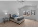 A bedroom with a ceiling fan, hardwood floors, and a window with a view at 505 Colleton Rd, Raleigh, NC 27610
