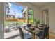 Bright dining area with an open sliding glass door leading to a backyard patio at 505 Colleton Rd, Raleigh, NC 27610