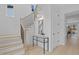 Bright entryway featuring a staircase with black metal railings and modern design elements at 505 Colleton Rd, Raleigh, NC 27610