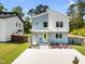 Charming two-story home showcasing a modern design and landscaped front yard with inviting curb appeal at 505 Colleton Rd, Raleigh, NC 27610