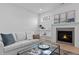 Living room featuring a modern fireplace and comfortable seating at 505 Colleton Rd, Raleigh, NC 27610