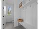 Mud room with built-in storage, hooks, and seating for organization and convenience at 505 Colleton Rd, Raleigh, NC 27610
