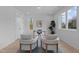 Bright home office with large windows, modern furnishings, and a minimalist aesthetic at 505 Colleton Rd, Raleigh, NC 27610