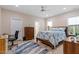 Bright bedroom with a ceiling fan, two windows, and stylish furnishings creating a relaxing personal retreat at 5129 Cardinal Cir, Sanford, NC 27332