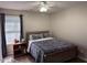Bedroom with a bed, a bedside table, and a window with natural light at 5264 Patuxent Dr, Raleigh, NC 27616