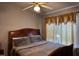 Comfortable bedroom featuring a ceiling fan and decorative curtains for a cozy ambiance at 5264 Patuxent Dr, Raleigh, NC 27616
